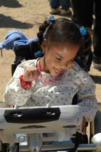 child with aac device